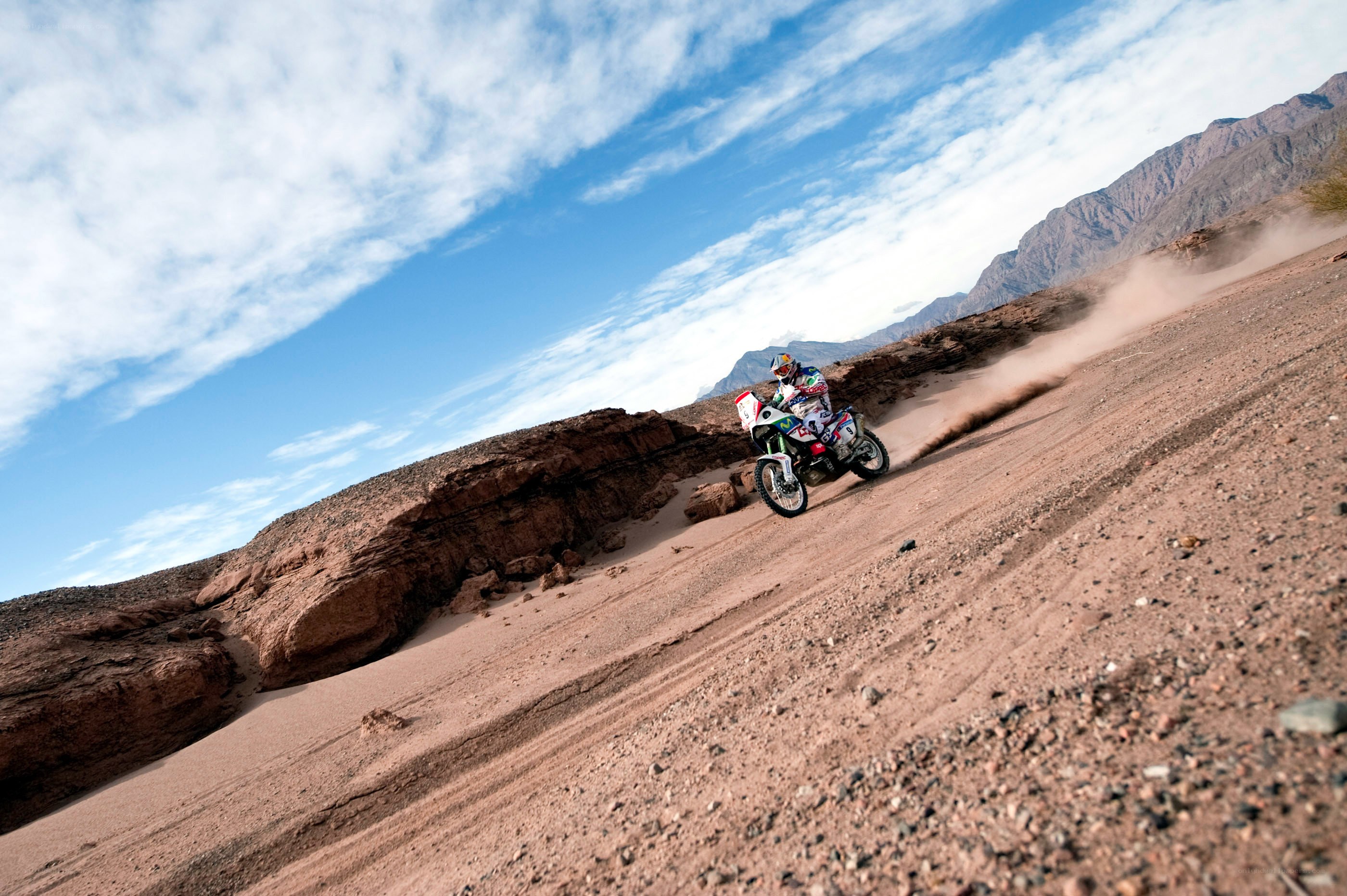 Motorcycle racer on desert track