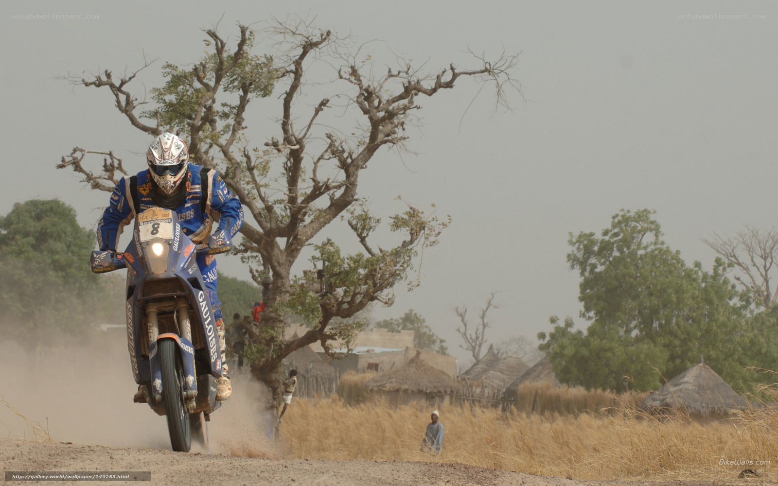 motorcycle racer on dirt road