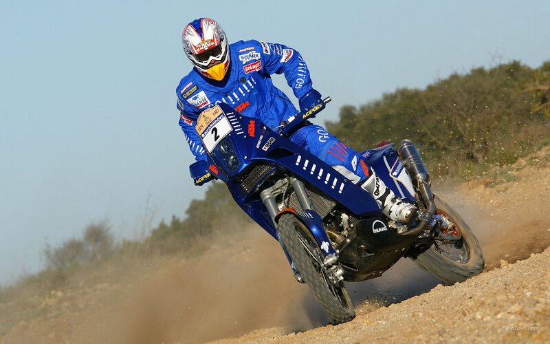 Motorcycle racer on dirt track
