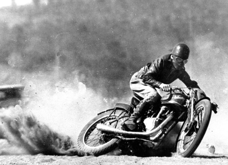 Motorcycle racer on dirt track