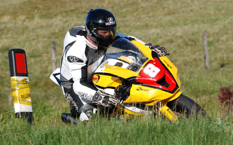 Motorcycle Racer on Grass