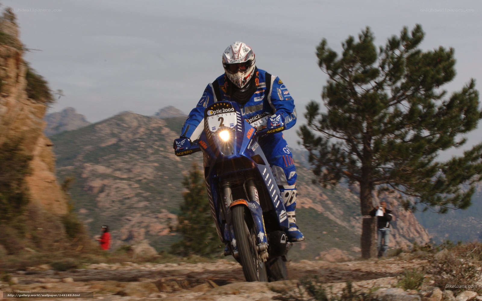 Motorcycle racer on mountain trail