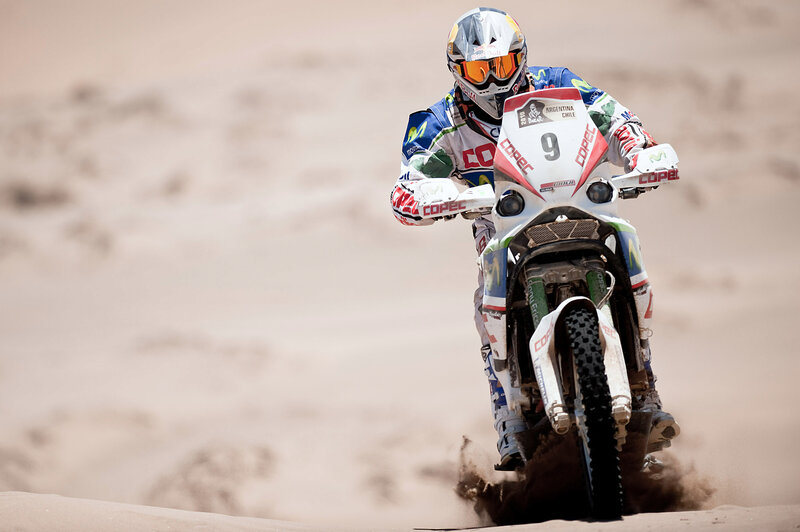 Motorcycle racer on sand dunes