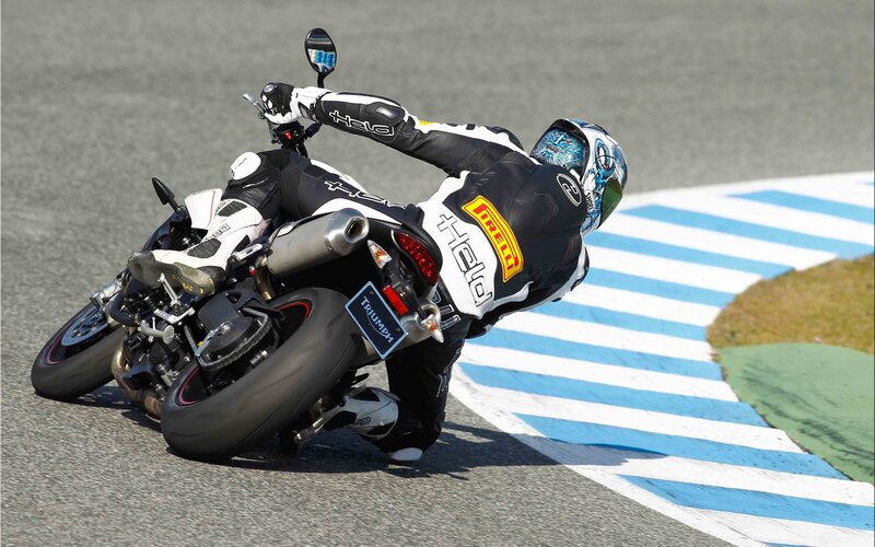 Motorcycle Racer on Track — Black, Dynamic, Afternoon, Photograph, Blue and White Stripes