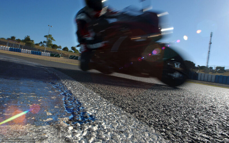 Motorcycle Racer on Track — Black, Dynamic, Afternoon, Photograph, Blue Barriers