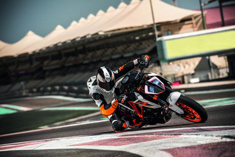 Motorcycle Racer on Track — Black, Dynamic, Afternoon, Photograph, Racetrack, Stadium