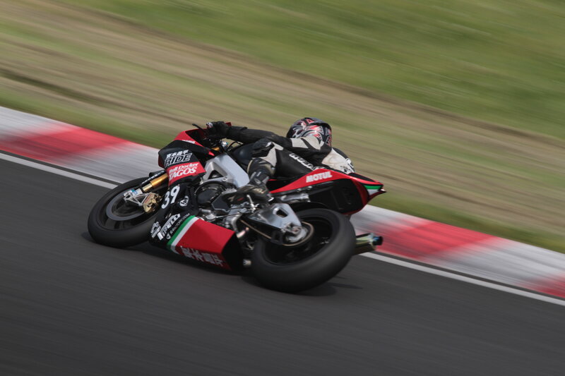 Motorcycle Racer on Track — Black, Dynamic, Afternoon, Photograph, Red, Green