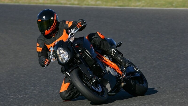 Motorcycle Racer on Track — Black, Dynamic, Afternoon, Photograph, Rider, Racetrack, Orange