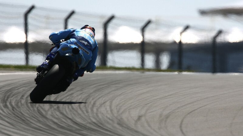 Motorcycle Racer on Track — Blue, Dynamic, Afternoon, Photograph, Fence, Gray