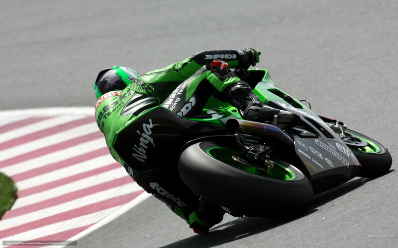 Motorcycle Racer on Track — Green, Dynamic, Afternoon, Photograph, Racing Suit, Striped Curb
