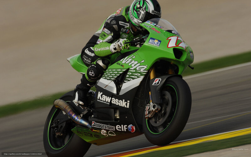 Motorcycle Racer on Track — Green, Dynamic, Photograph, Racing Suit, Helmet, Race Track