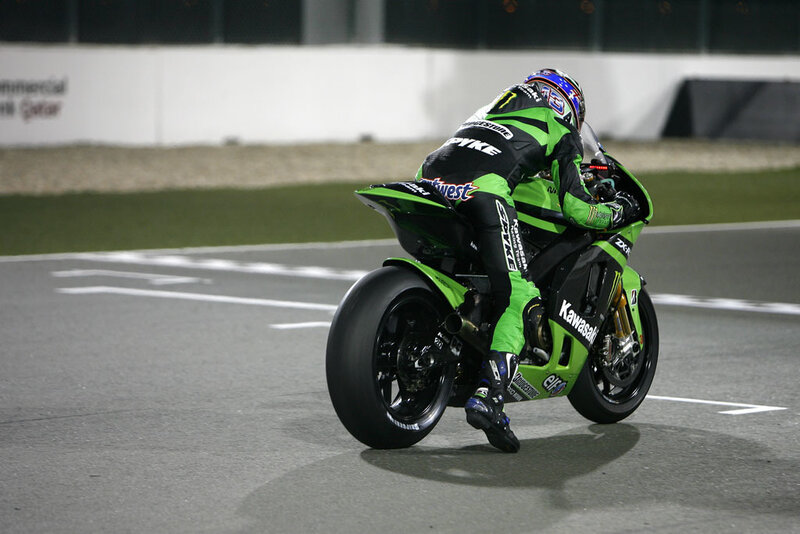 Motorcycle Racer on Track — Green, Focused