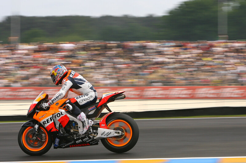 Motorcycle Racer on Track — Orange, Dynamic, Afternoon, Photograph, Crowd, Race Track