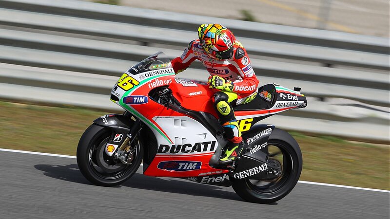 Motorcycle Racer on Track — Red, Dynamic, Afternoon, Photograph, Racing Suit, Helmet, Ducati Bike