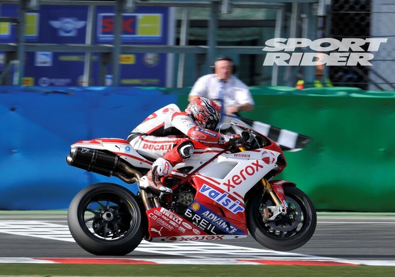 Motorcycle Racer on Track — Red, Dynamic, Afternoon, Photograph, Safety Barrier