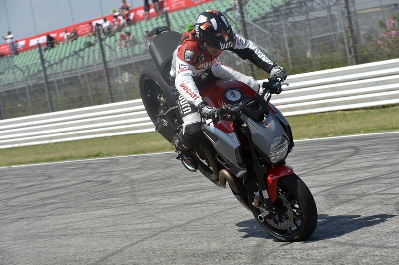 Motorcycle Racer on Track — Red, Dynamic, Afternoon, Photograph, Spectators, Black