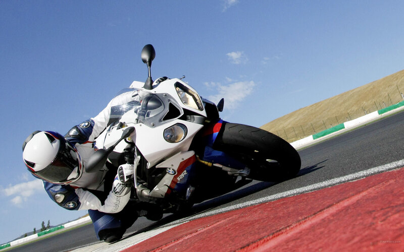 Motorcycle Racer on Track — White, Dynamic, Afternoon, Photograph, Racetrack, Sky, Blue