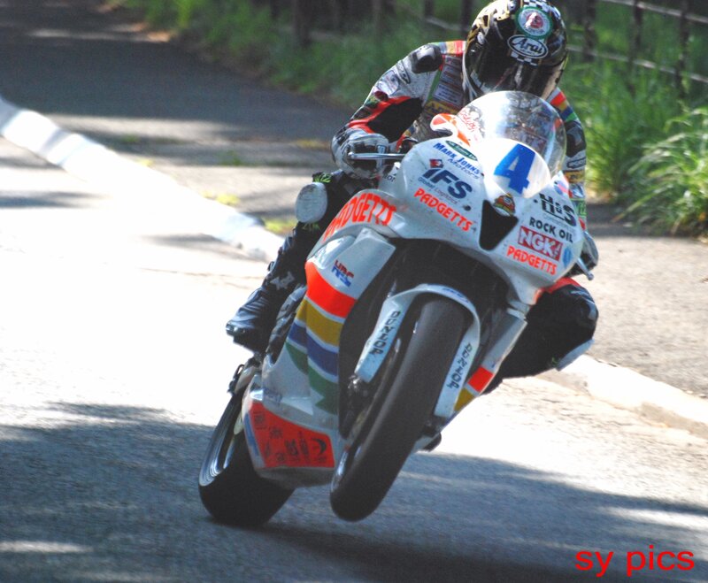 Motorcycle Racer on Track — White, Dynamic, Afternoon