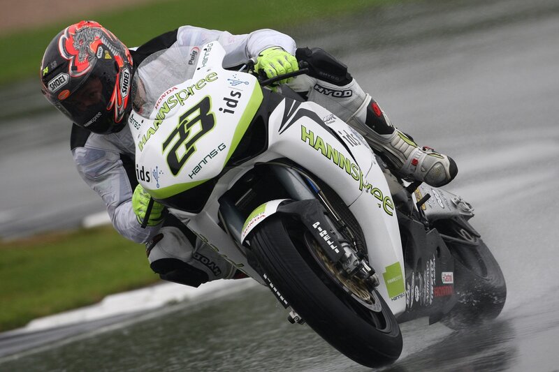 Motorcycle racer on wet track