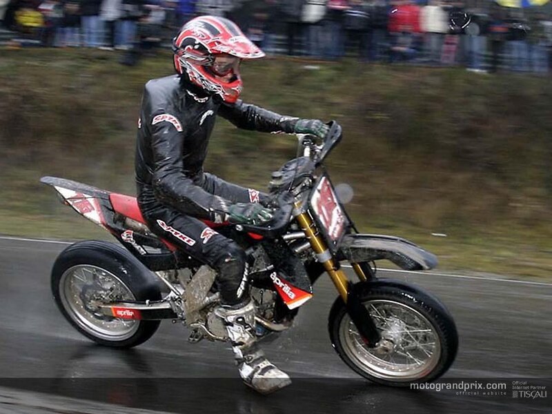 motorcycle racer on wet track