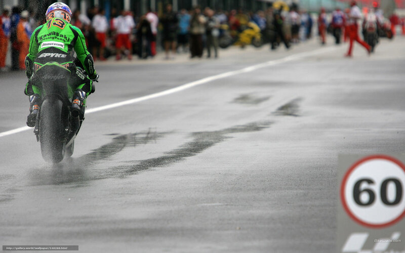 motorcycle racer on wet track