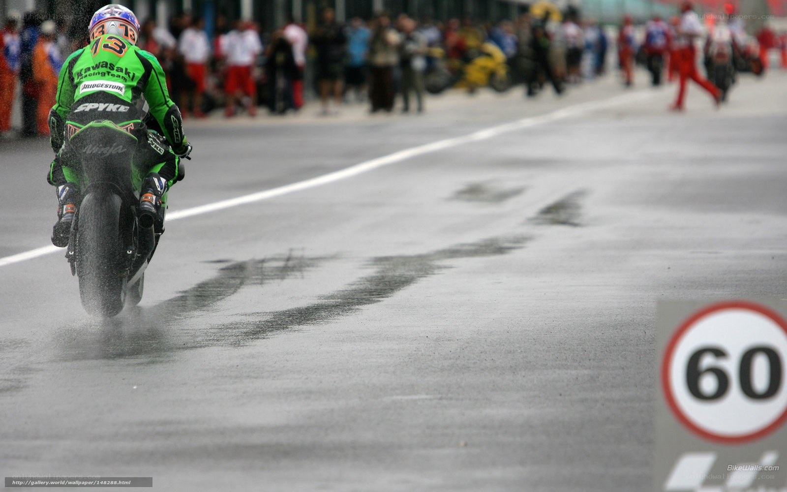 motorcycle racer on wet track