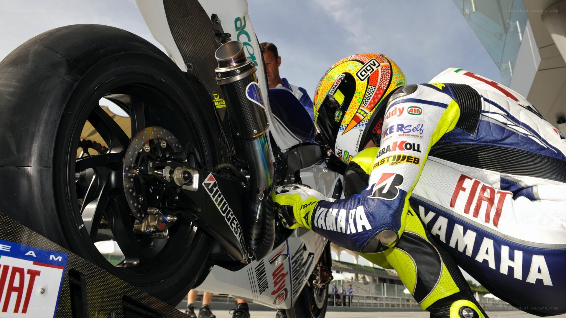 motorcycle racer preparing bike