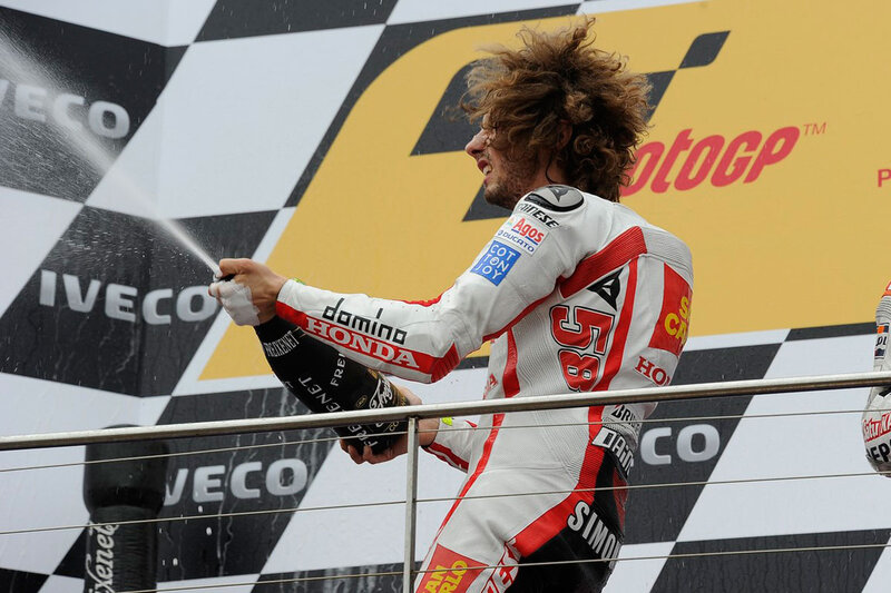 Motorcycle Racer Spraying Champagne