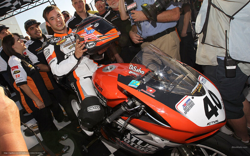 Motorcycle racer with bike and helmet