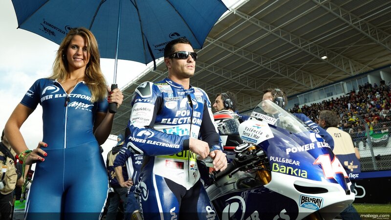 Motorcycle racer with grid girl