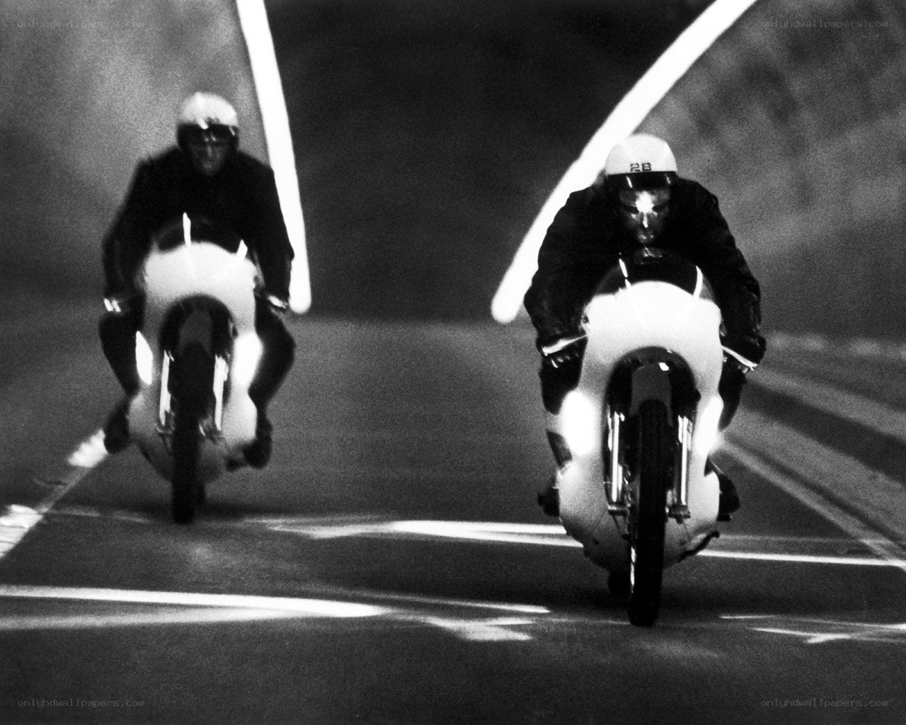 Motorcycle racers at night