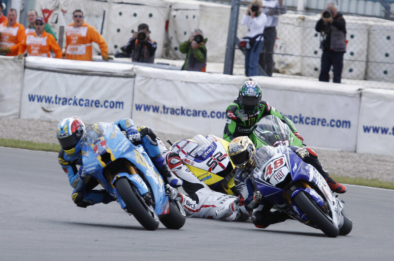 Motorcycle racers in a tight turn