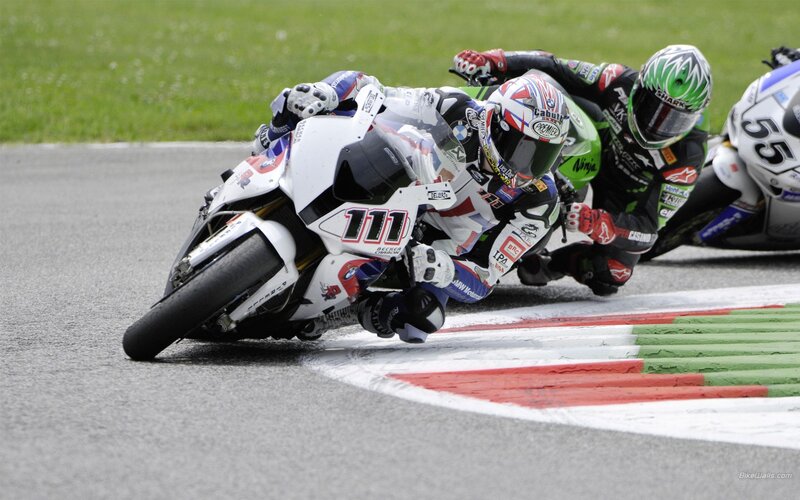 Motorcycle racers in a tight turn