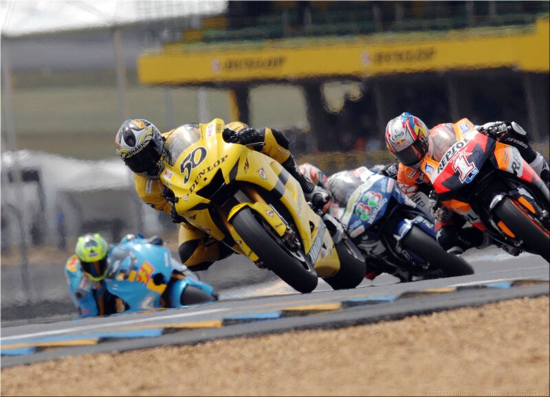 Motorcycle racers in a tight turn