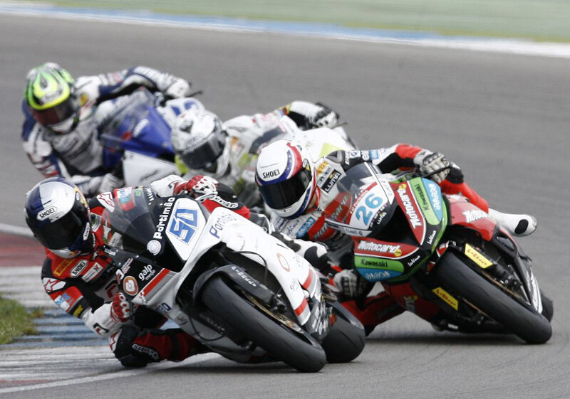 Motorcycle racers in a tight turn