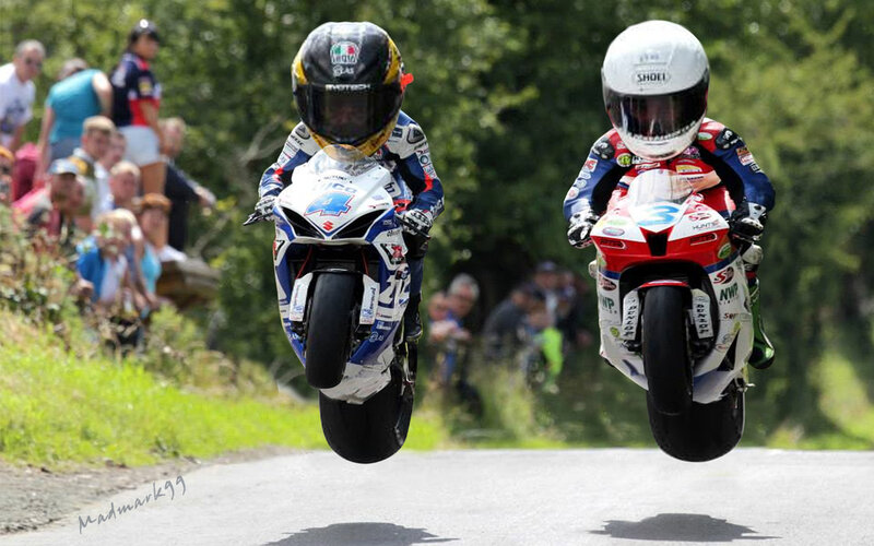 Motorcycle Racers in Mid-air