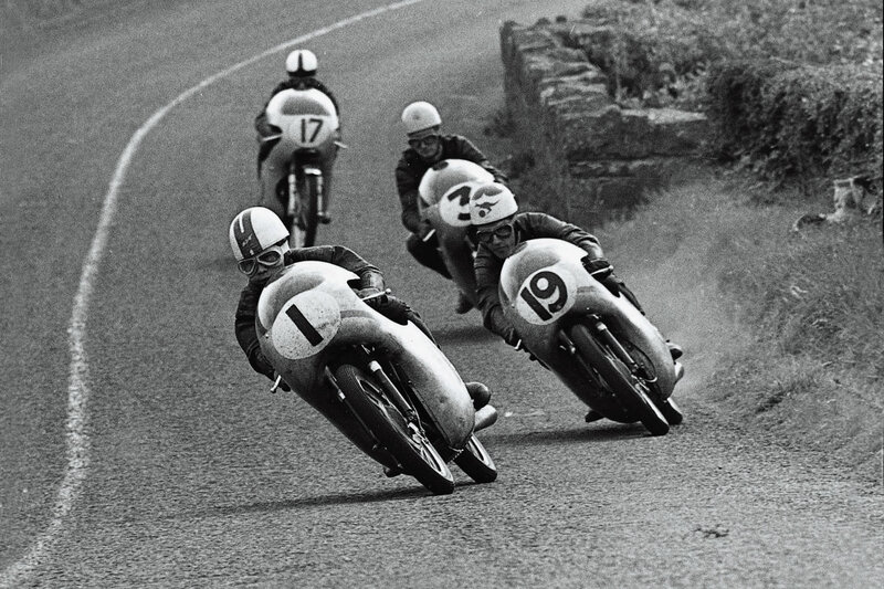 Motorcycle racers on a curve