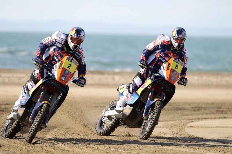 Motorcycle racers on beach