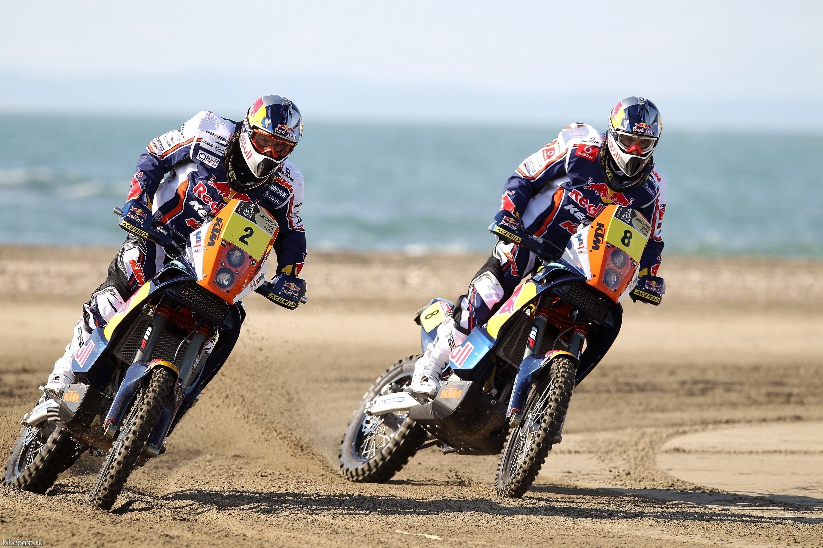 Motorcycle racers on beach