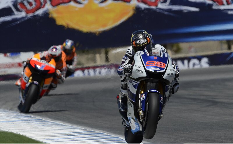 Motorcycle Racers on Track — Blue, Dynamic, Afternoon, Photograph, Racing Bikes, Safety Barriers