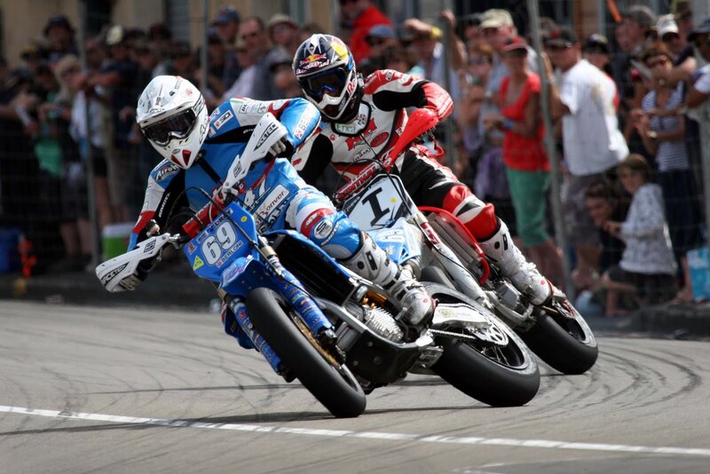 Motorcycle Racers on Track — Blue, Intense, Afternoon, Photograph, Crowd