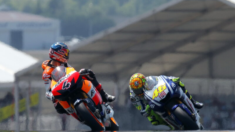 Motorcycle Racers on Track — Orange, Competitive