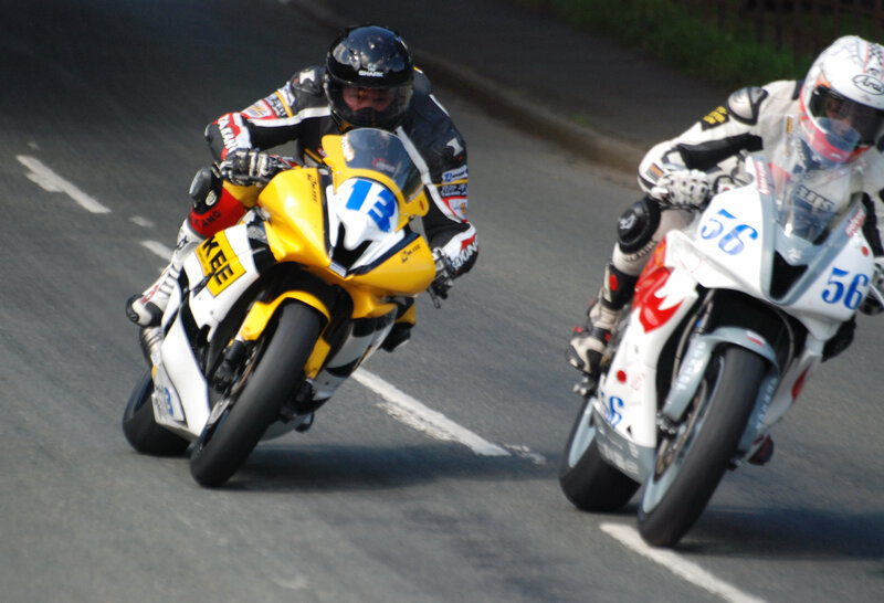 Motorcycle Racers on Track — Yellow