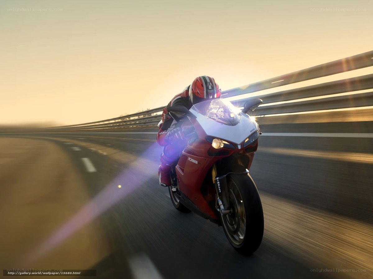 Motorcycle racing at sunset