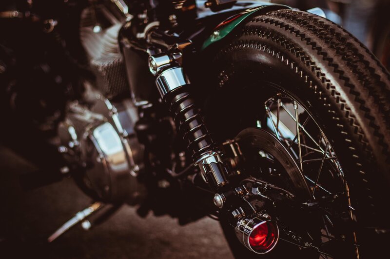 Motorcycle Rear Wheel — Black, Dramatic, Photograph, Shock Absorber