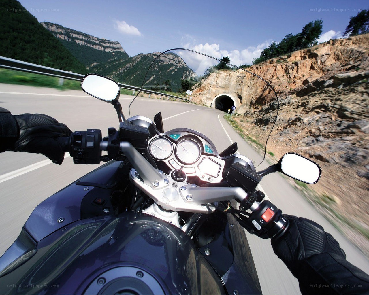motorcycle ride through mountain tunnel