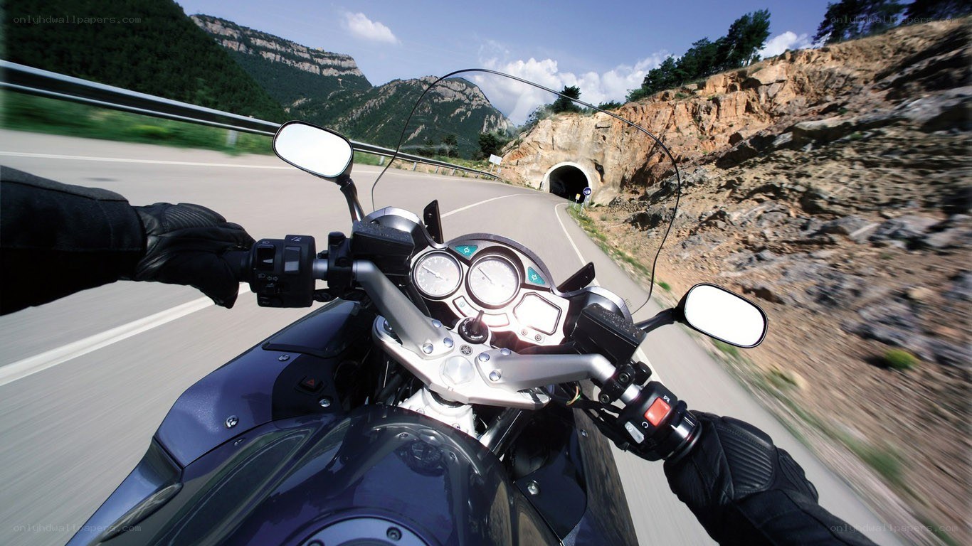 motorcycle ride through mountain tunnel
