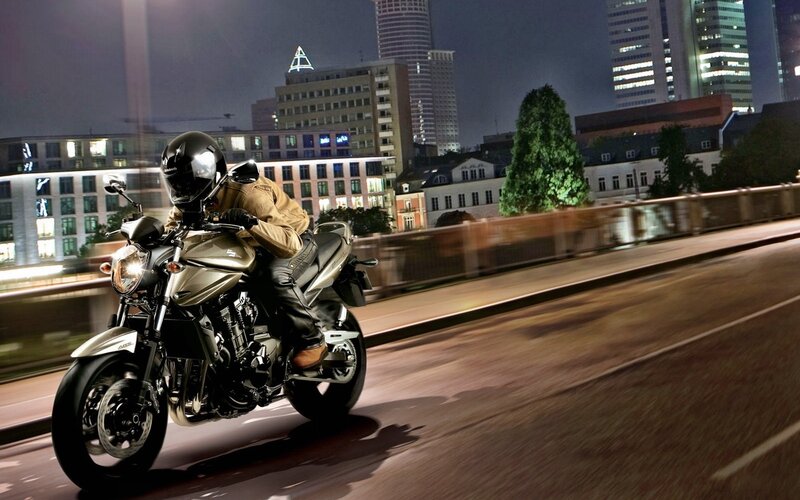 motorcycle rider at night in city