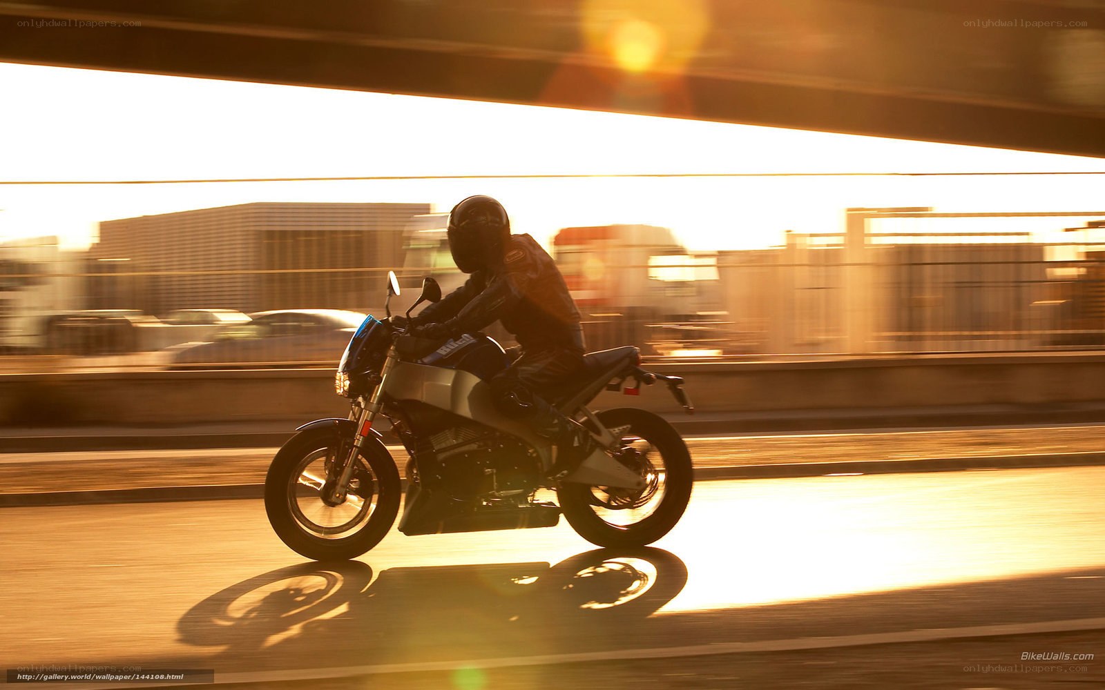 Motorcycle rider at sunset