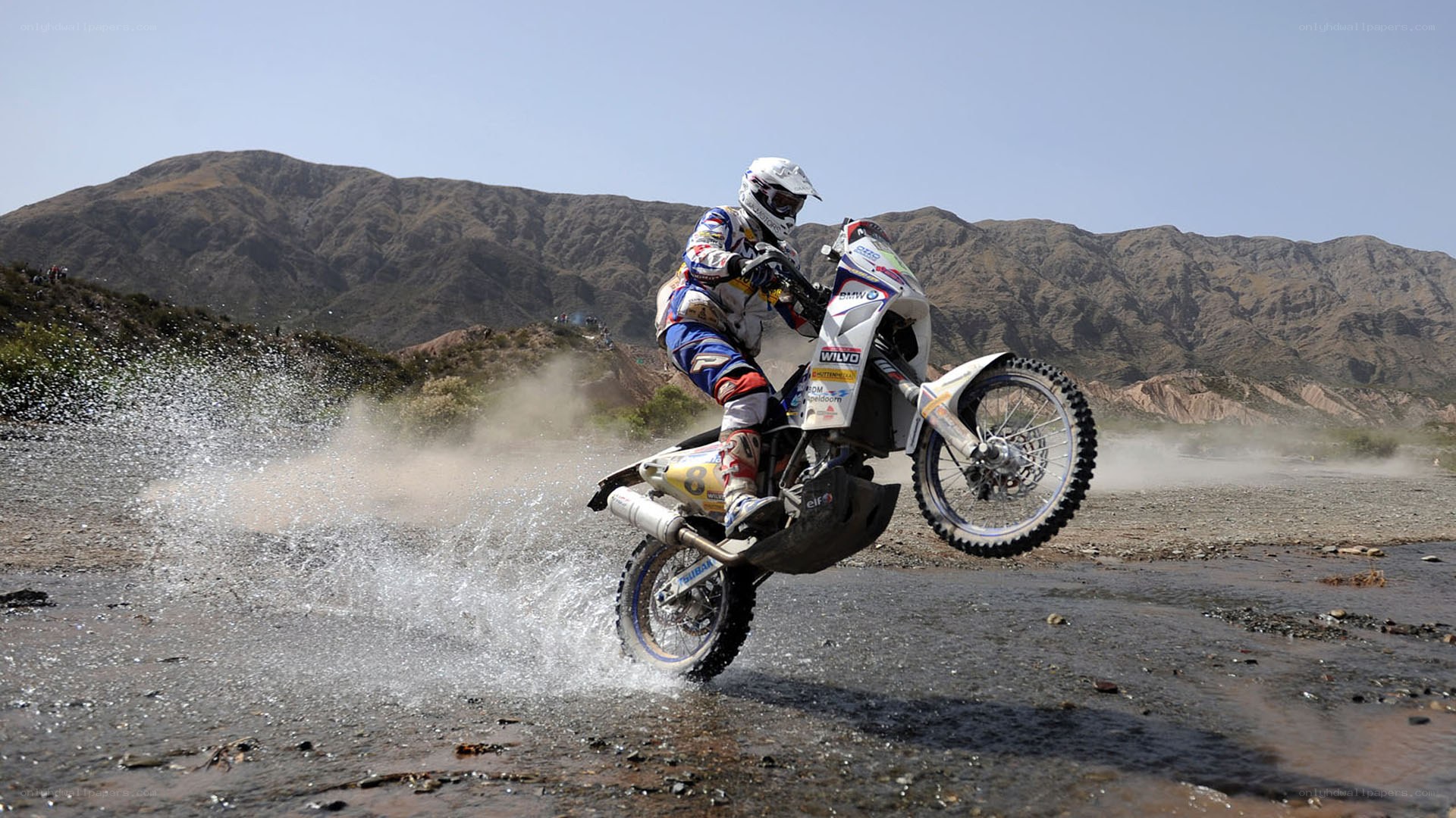 Motorcycle rider crossing river